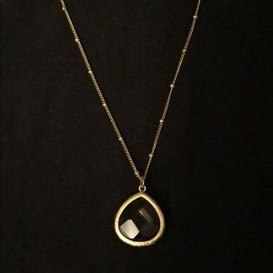 Necklace with amber gray pendent